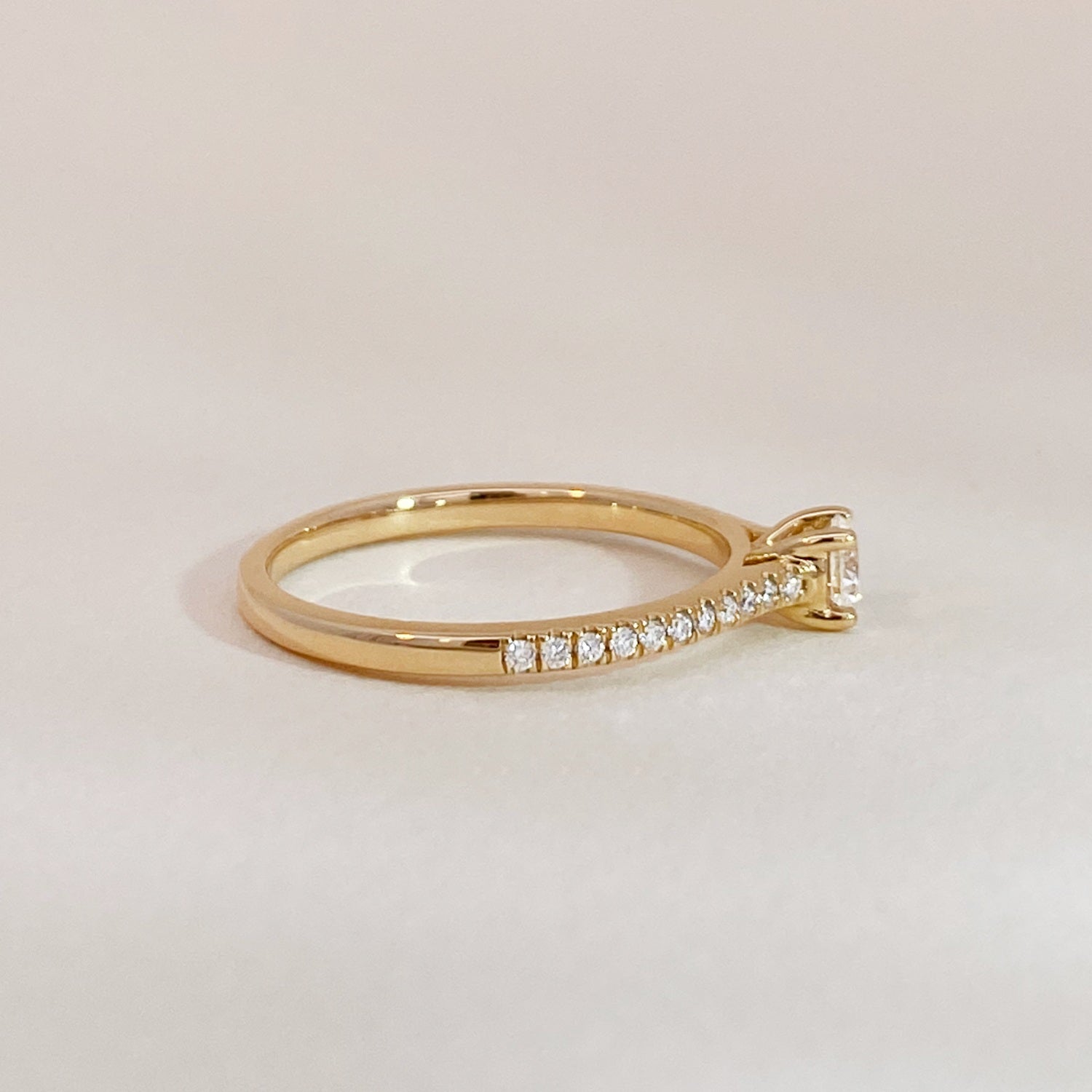 Solitaire on Diamonds Engagement Ring Gold