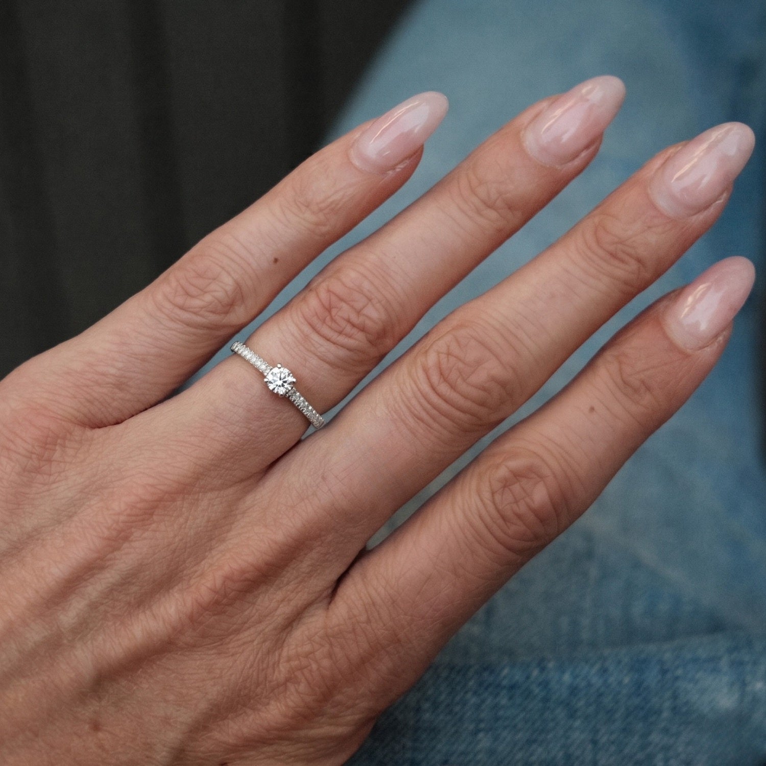 White Solitaire on Diamonds Engagement Ring