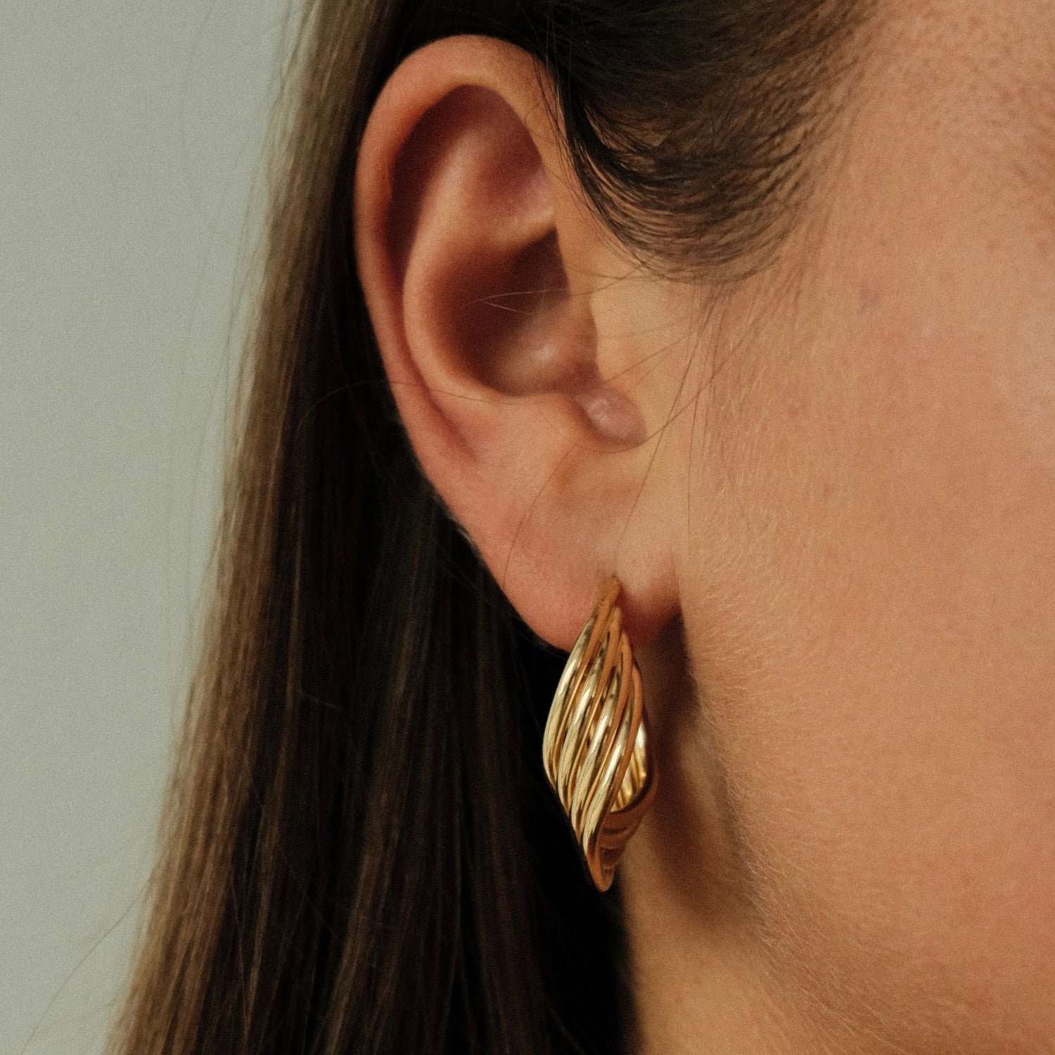 Bold unique twist hoops