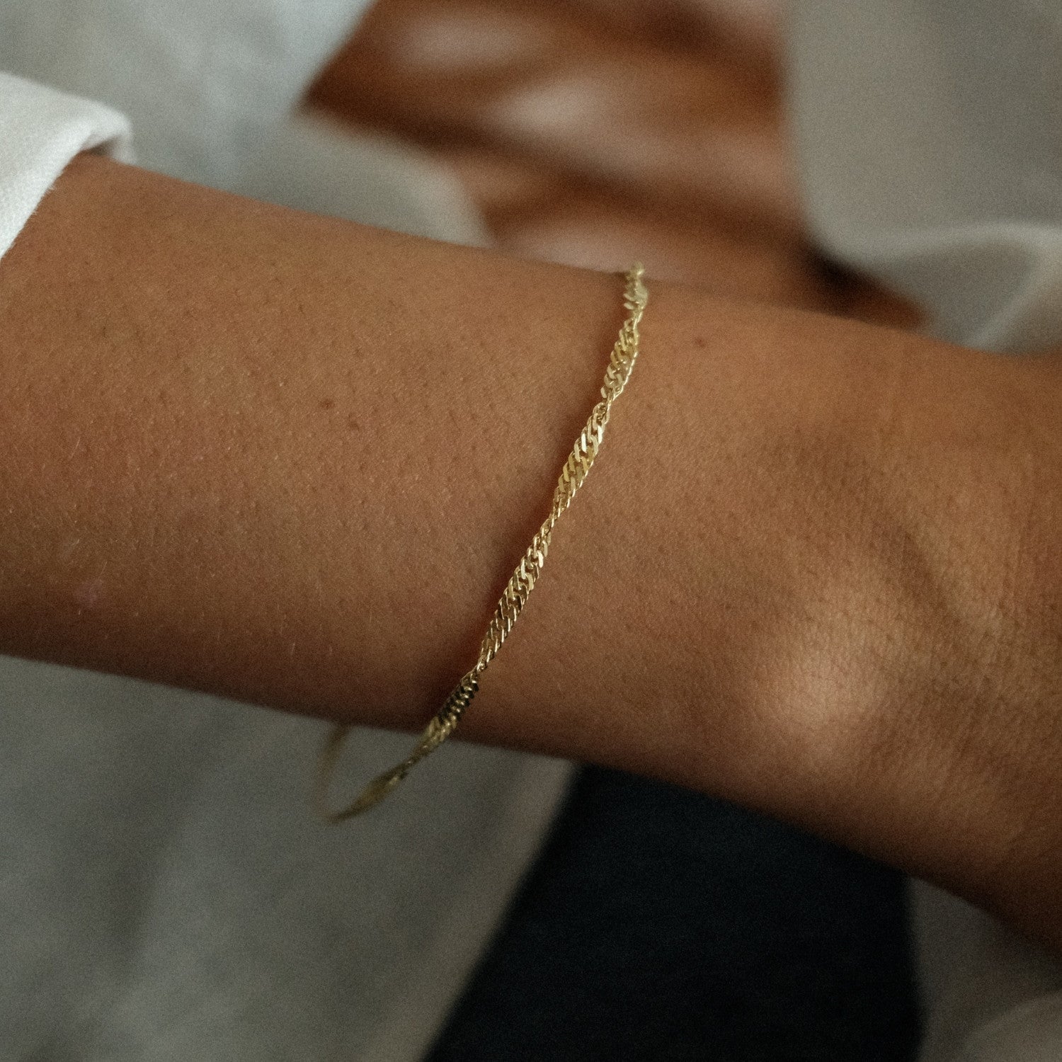 Gedraaide gouden armband
