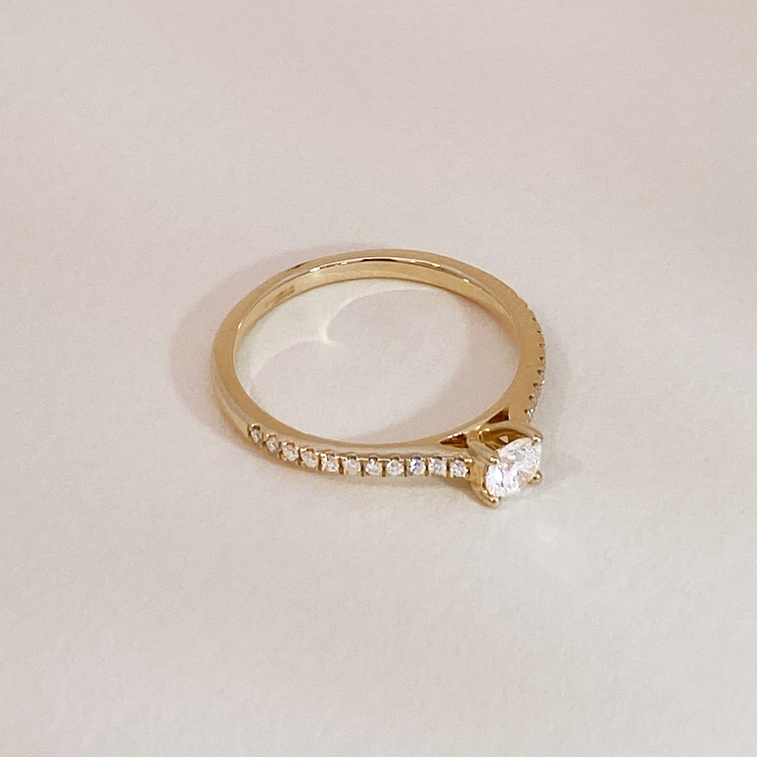 Gold Solitaire on Diamonds Engagement Ring
