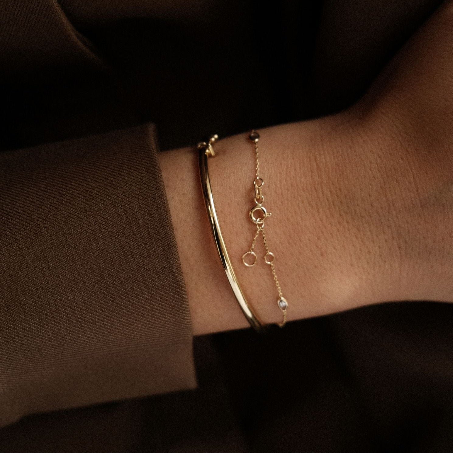 Gouden bangle en armband