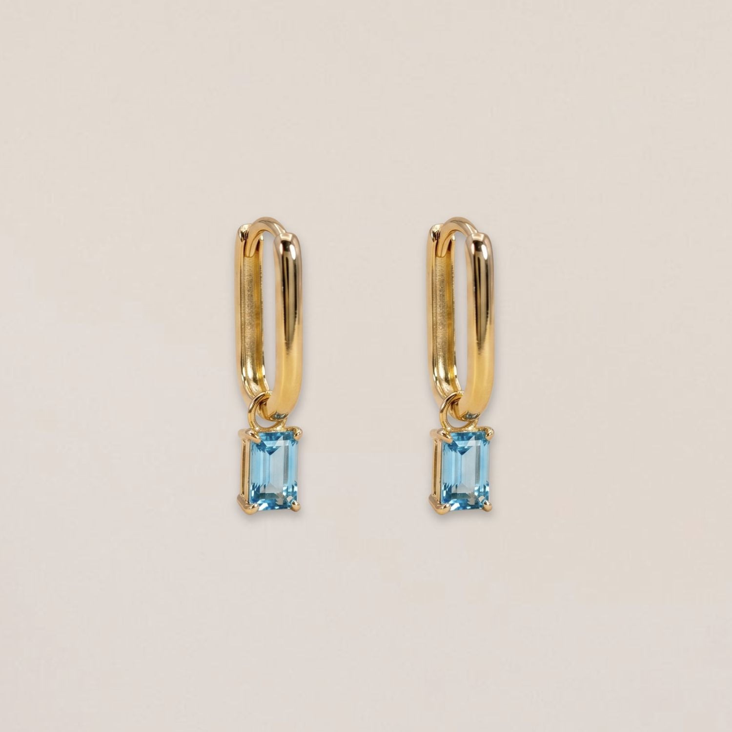 Long elegant hoops with blue topaz earring charm