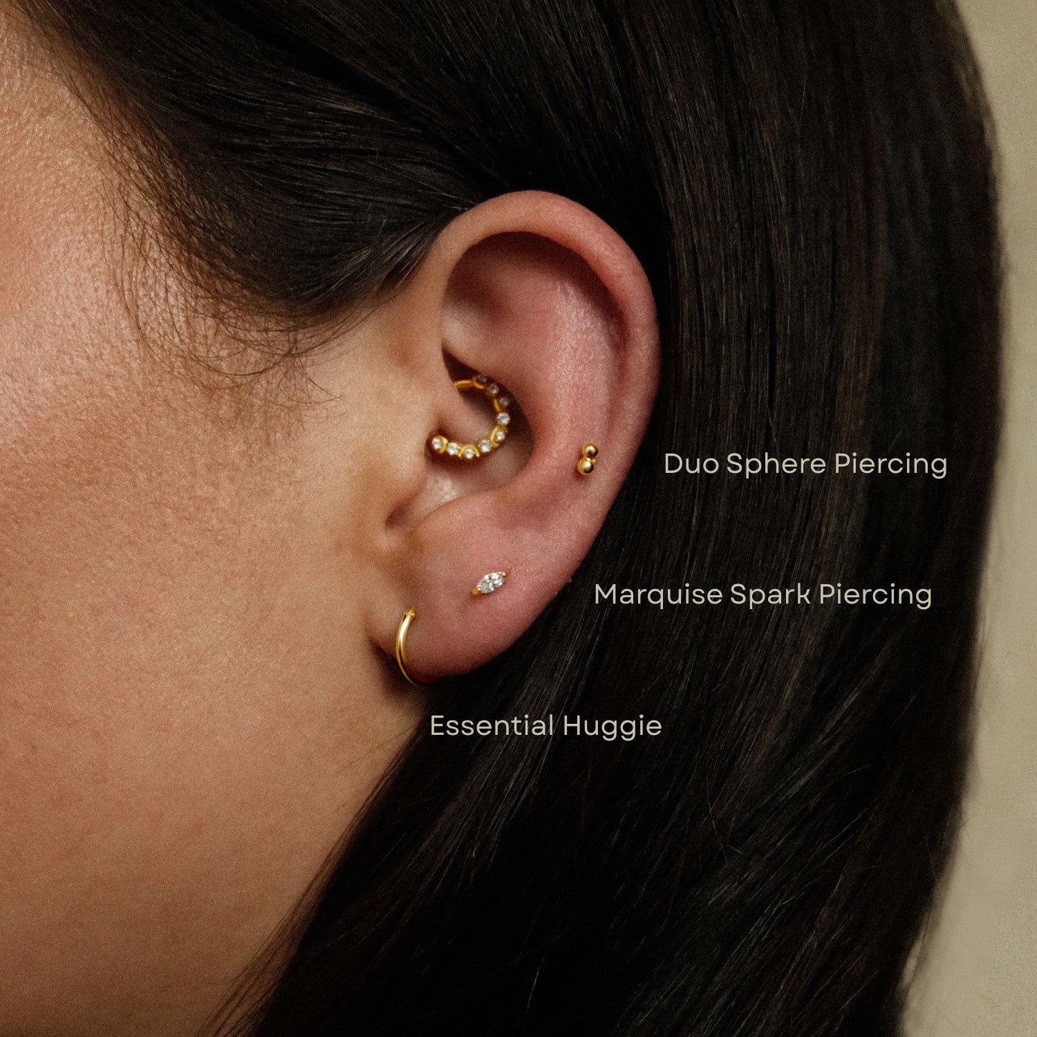 Piercing met bolletjes en marquise steentje