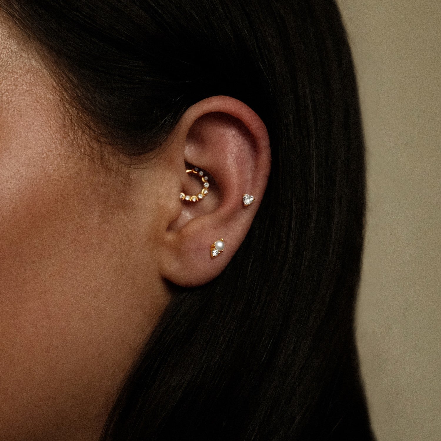 Piercings met hartje en parel