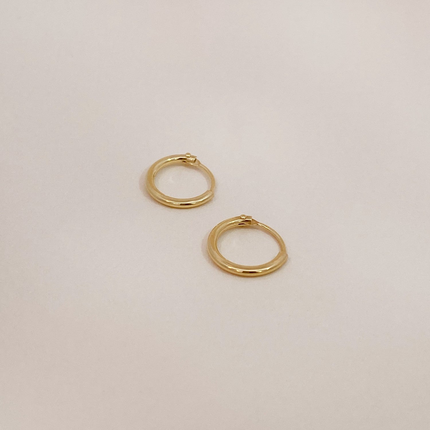 Tiny gold huggies