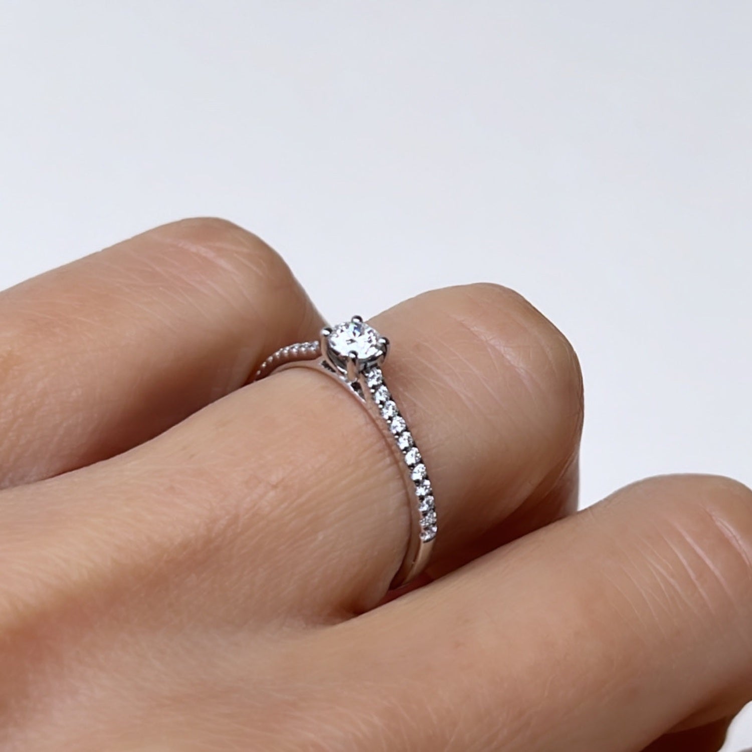 White Solitaire on Diamonds Ring