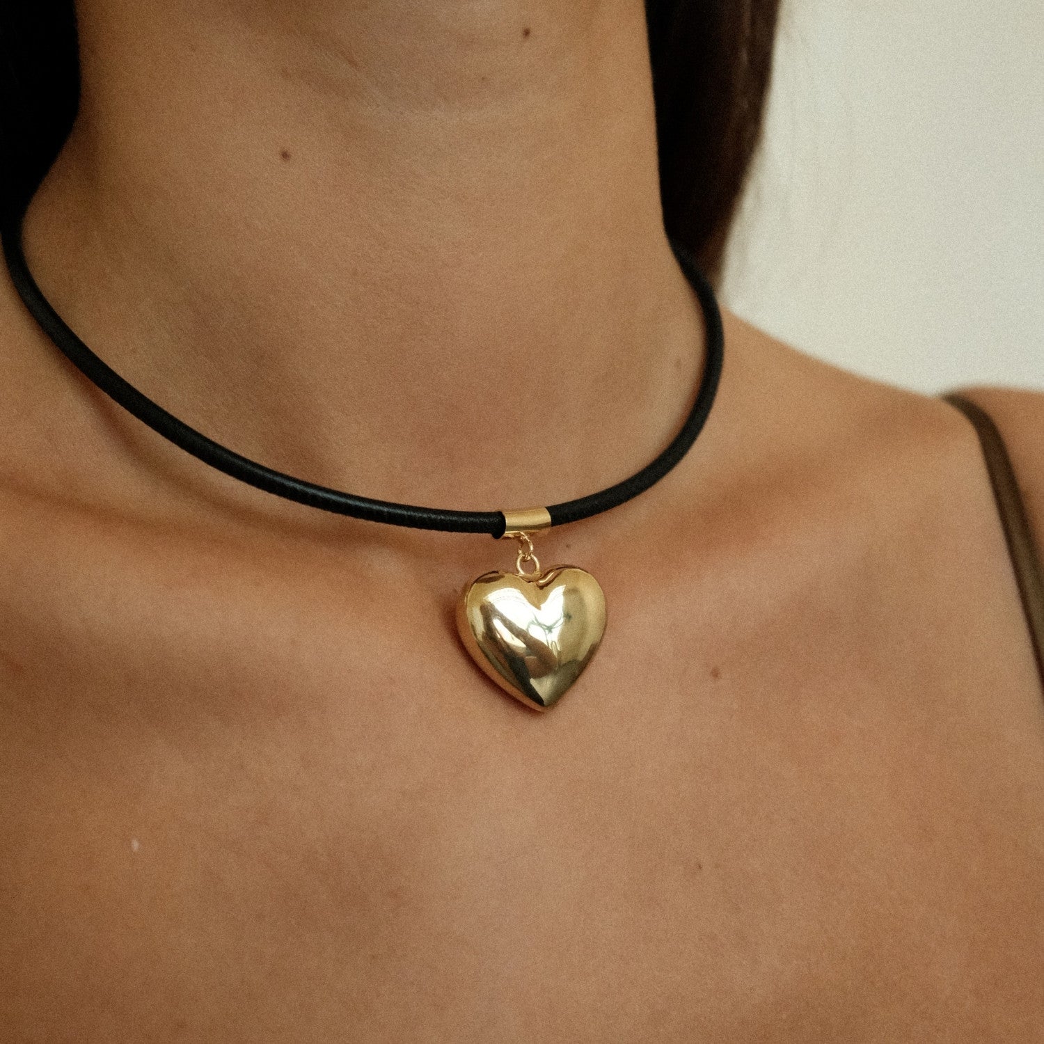 Zwart met goud hart ketting